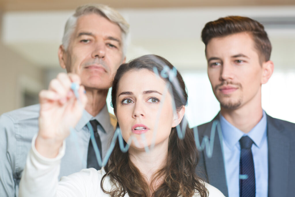 Serious Businesswoman Showing Graph Colleagues 1024x683