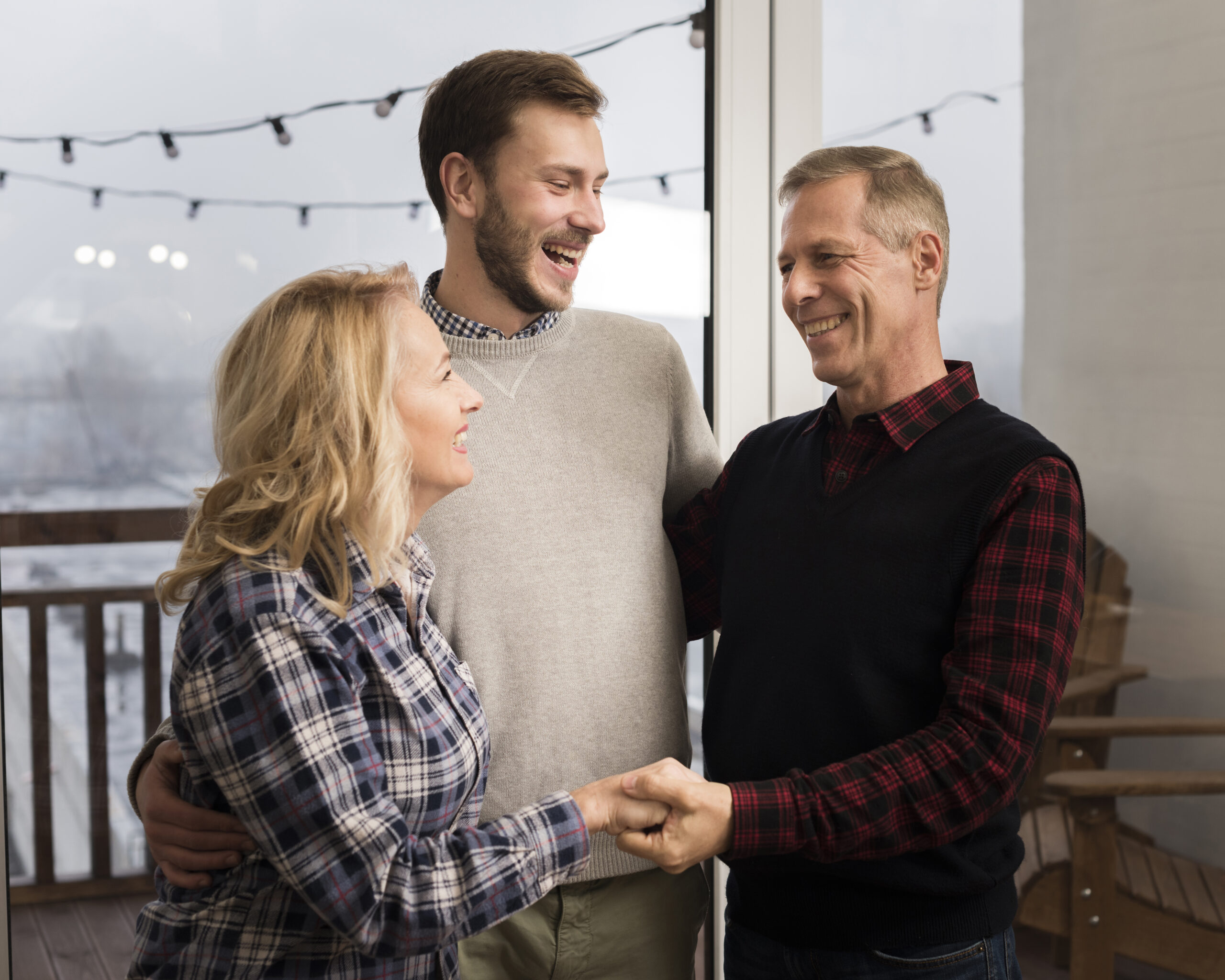 Smiley Parents Embracing Son Home Scaled