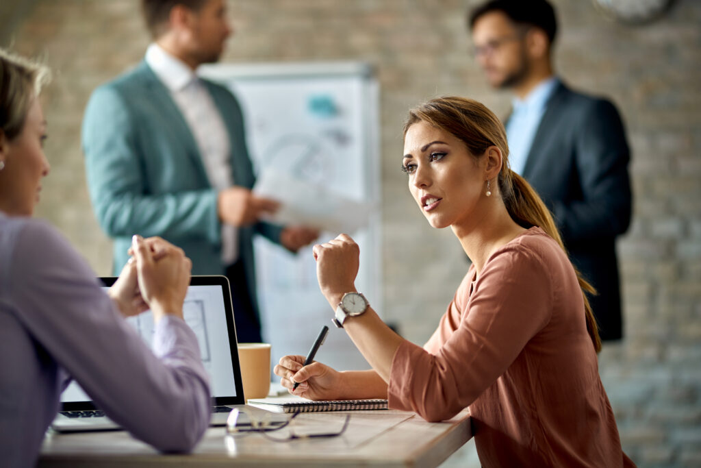 Young Businesswoman Talking Her Female Colleague Meeting Office 1024x683